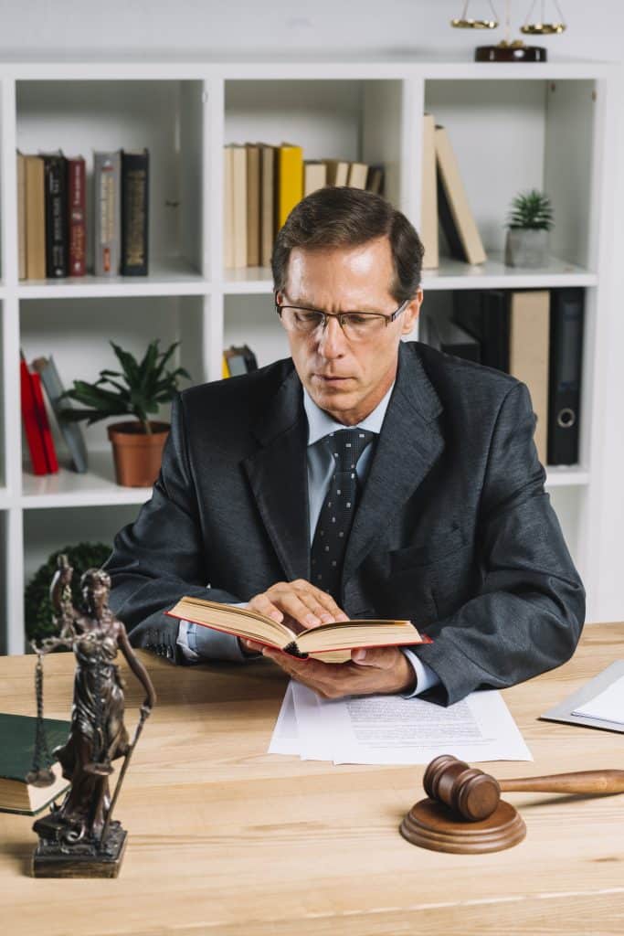 a male lawyer reading books